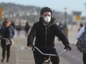 Bicyclist wearing a mask