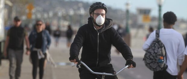 Bicyclist wearing a mask